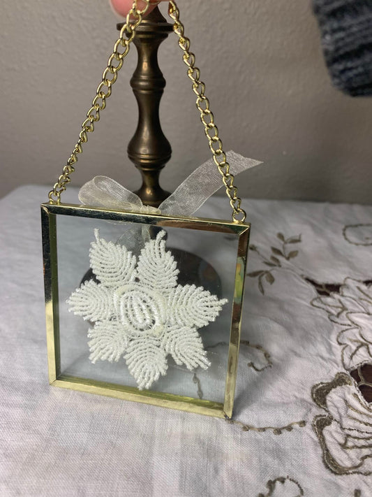 framed flower doily hanging